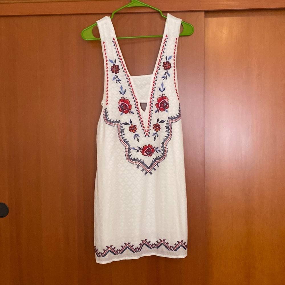 Xhiliration dress. Embroidery detail and side cut outs.